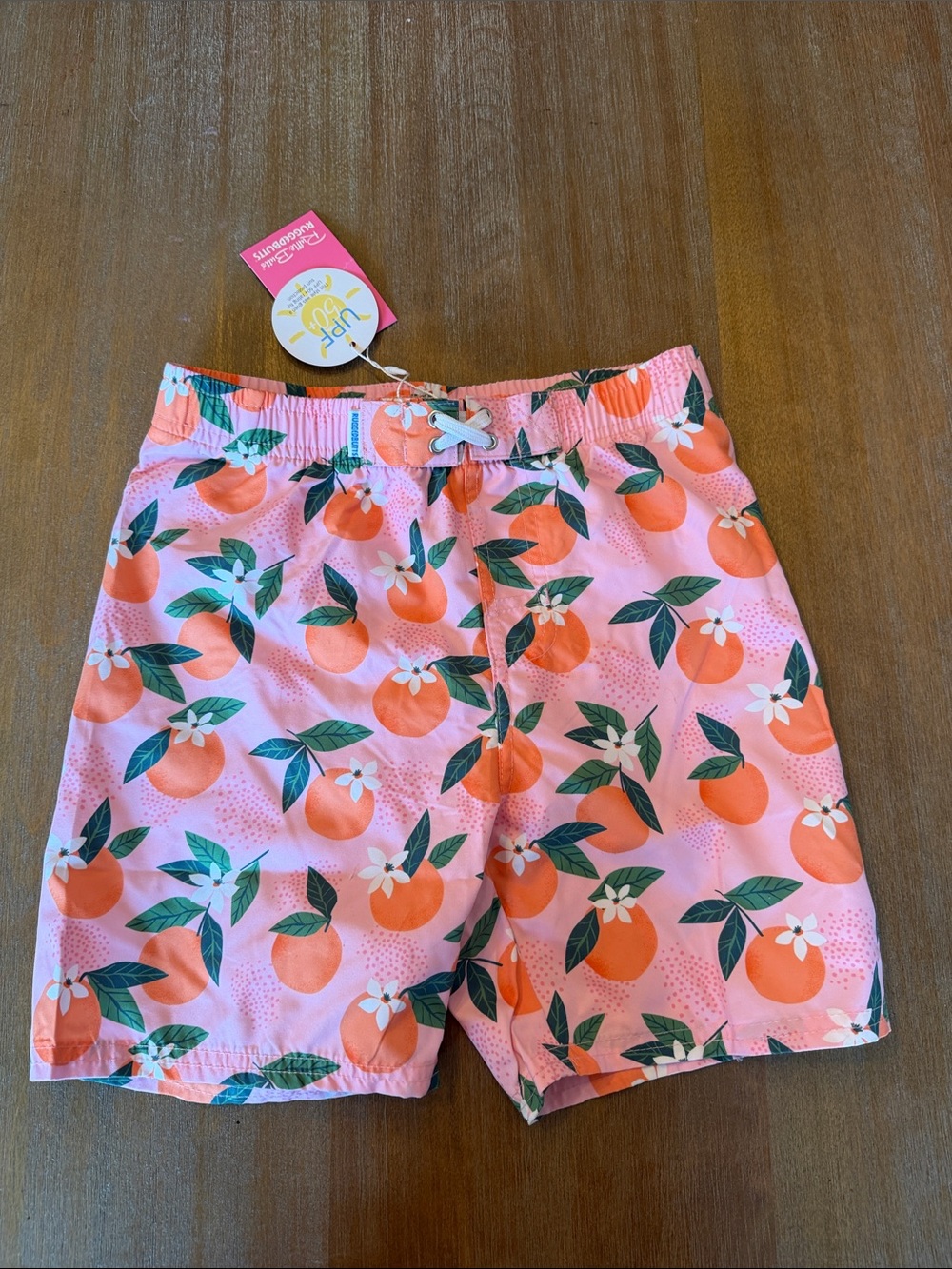 Ruffle Butts Pink Swim Trunks with Orange Citrus Print